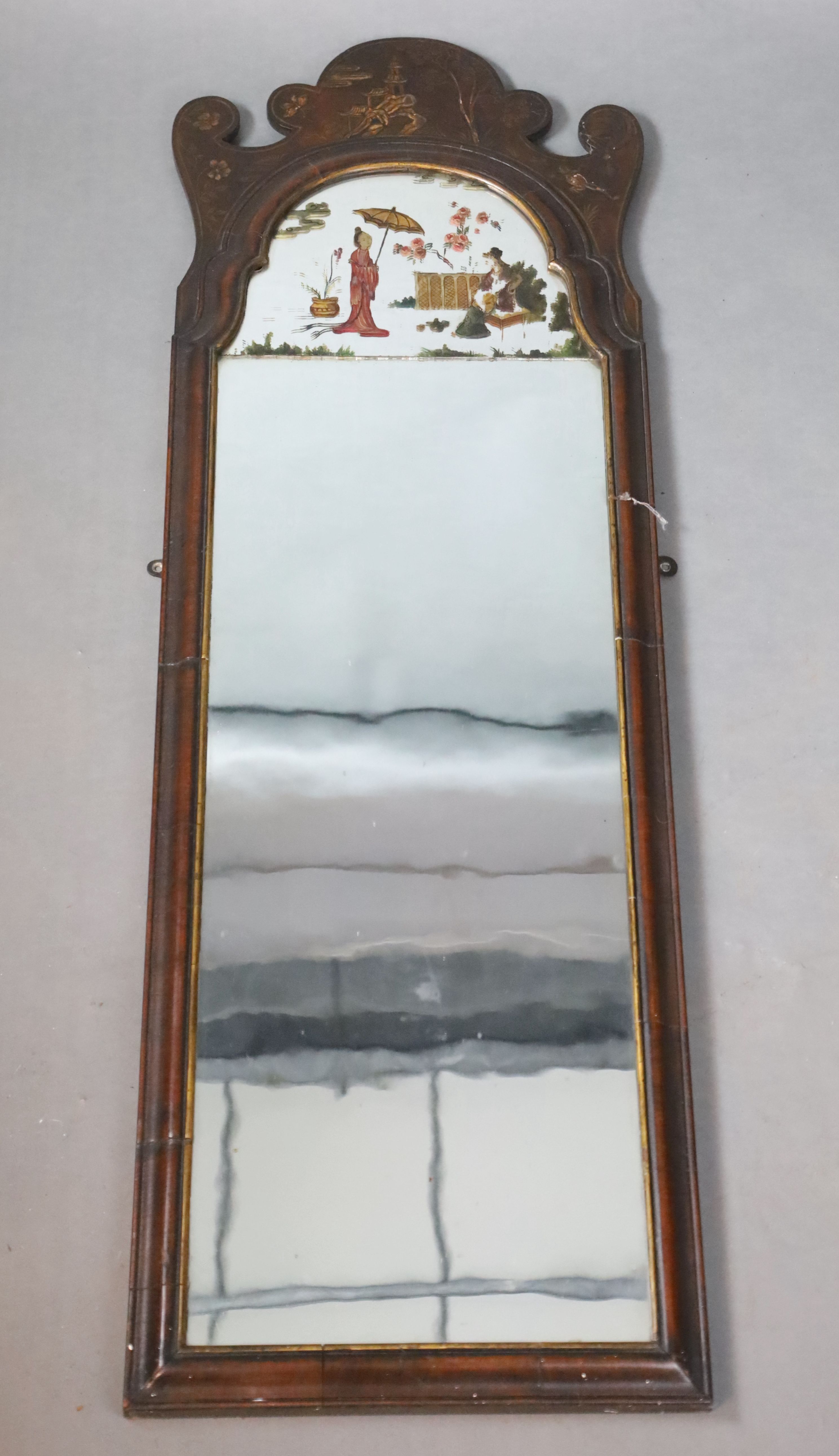 An early 18th century style chinoiserie lacquered walnut wall mirror, W.38cm H.119.5cm